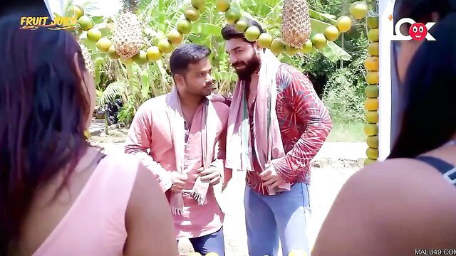 Indian men in colorful kurtas chatting under lime garlands in Fruit Juice adult web series