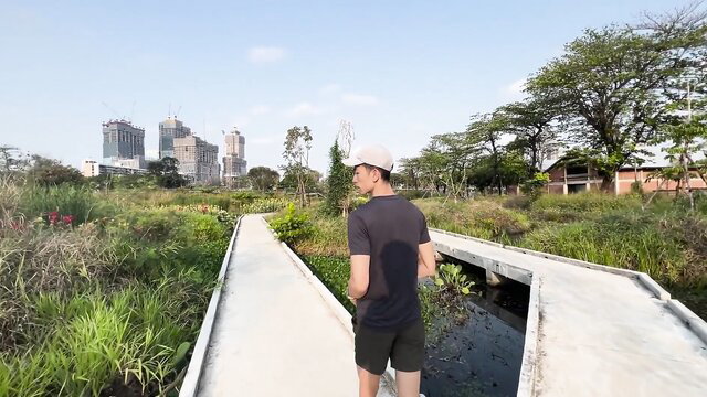 JoshyAndLocky outdoor walk in park, fit Asian guy in shorts and tee