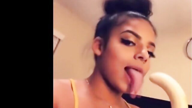 Black KKVSH model with bun licks thick banana teasingly, hot twerk tapes