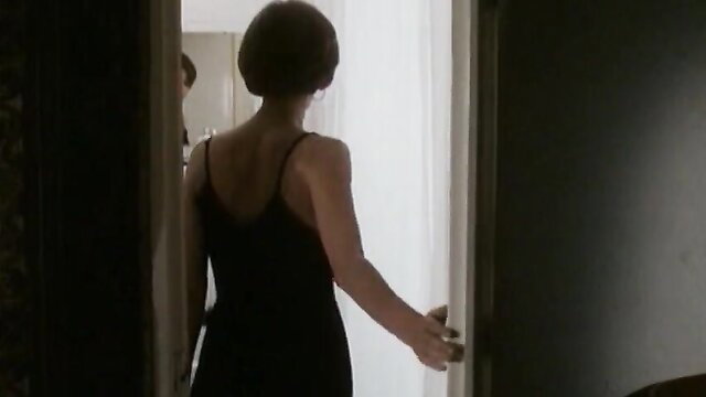 Lara Harris back view in black slip dress, nude tits celeb from The Zone 1995