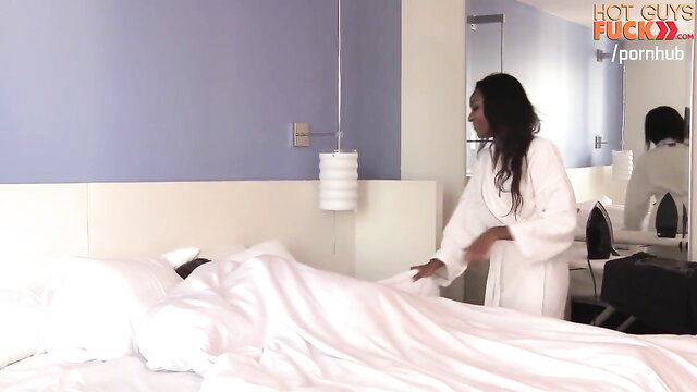 Black princess in white robe pulls sheets off nude black guy in bed