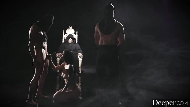 Katrina Jade kneels naked before Charles Dera on throne in dark fetish scene