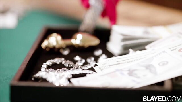 Cash, diamonds, gold spoon on tray in luxury Slayed lesbian scene