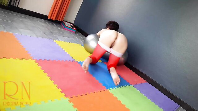 Regina Noir in red leotard bent over yoga ball, nude ass exposed