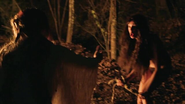 Aubrey Plaza and Kate Micucci in dark woods scene from The Little Hours