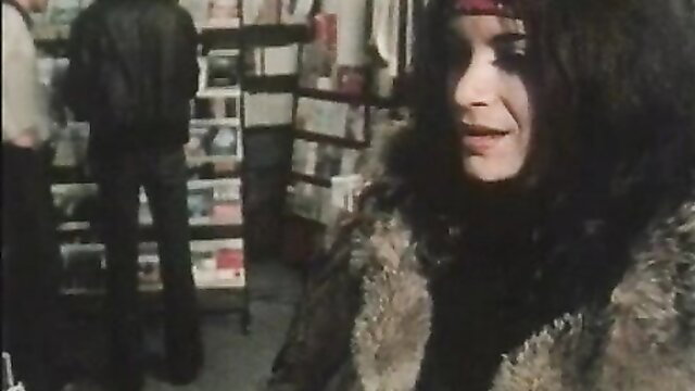 Vintage 1976 Beate Uhse porn starlet in fur coat & headband at Pleasure Shoppe