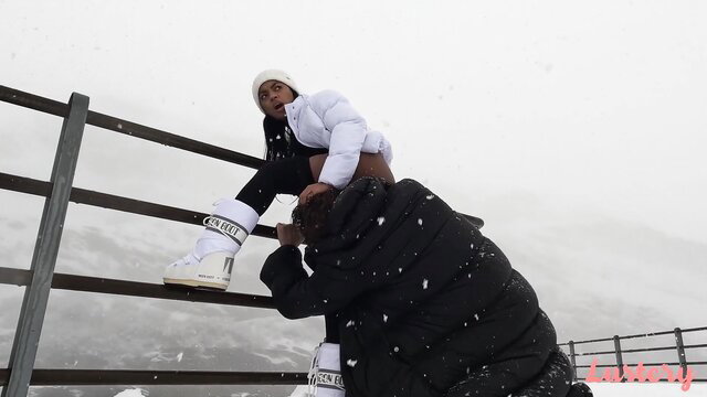 Essel & Sofi in white puffer jackets and moon boots outdoors in snow