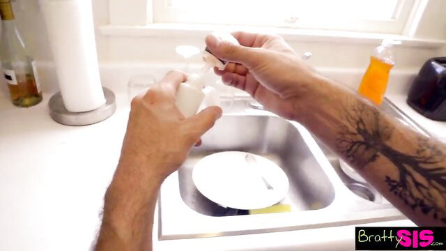 Bratty Sis bro hands dish soap in sink with tattooed arms