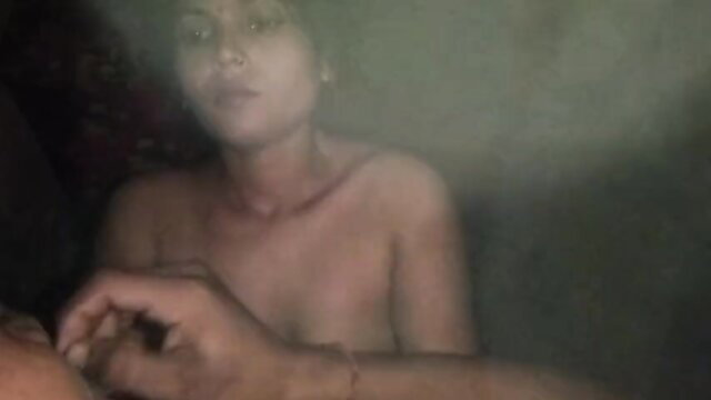 Simran Bhabhi nude in dim light, hand on breast, hardcore Indian amateur