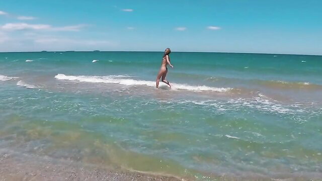 Sasha Bikeyeva nude walking in waves on Lago Saler beach Valencia