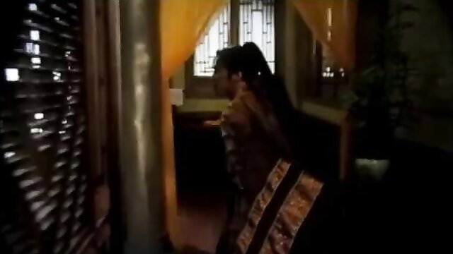 Asian woman in traditional dress peeking through window, Kim Bình Mai 1996