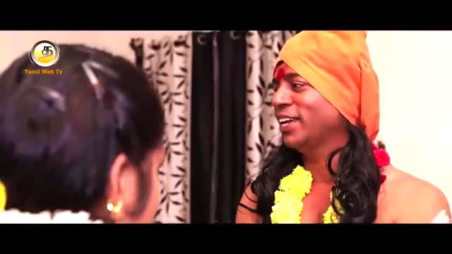 Tamil short film crossdresser in orange turban and garland with woman
