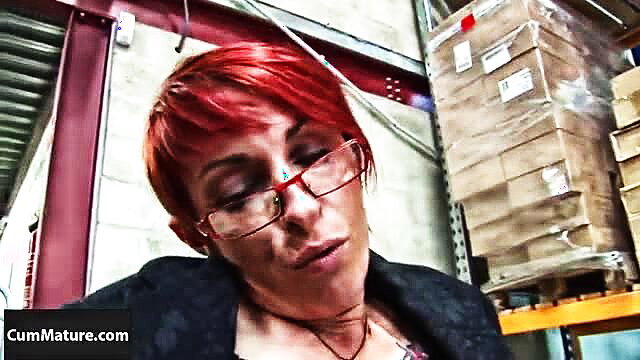 Redhead mature Katy Morlait closeup in glasses, seductive gaze