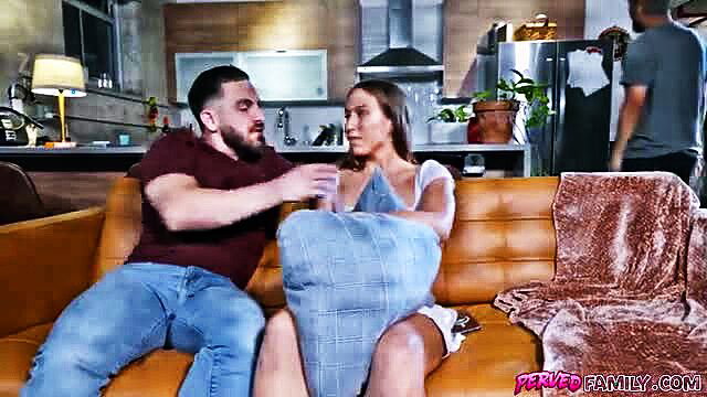 Peter Green points at Violet Reign wrapped in blanket on couch in Perved Family scene