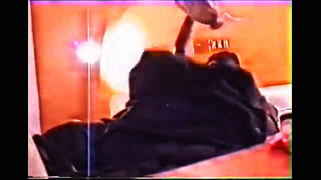Aunty Adiya mature ebony woman in black abaya on bed