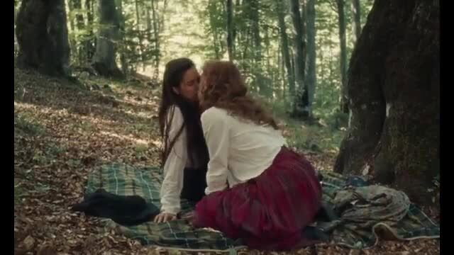 Vanessa Kirby and Katherine Waterston lesbian kiss in forest picnic