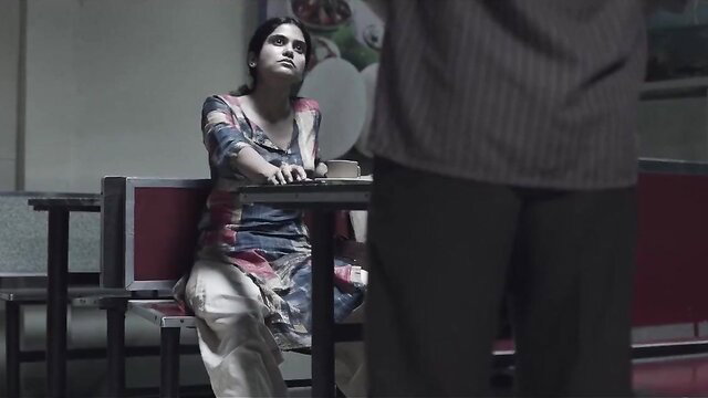 Indian girl in salwar teasing waiter at table in web series