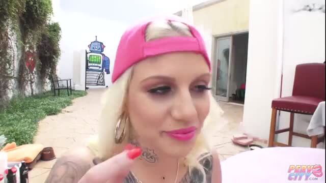Lucky B blonde tattooed model in pink cap teases outdoors at Perry's City