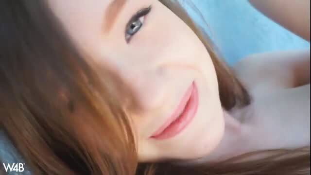 Busty brunette closeup smile, seductive nude outdoor tease
