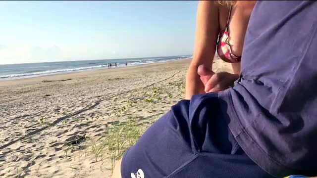 Jane R gives stranger public beach handjob, bikini tits out begging anal