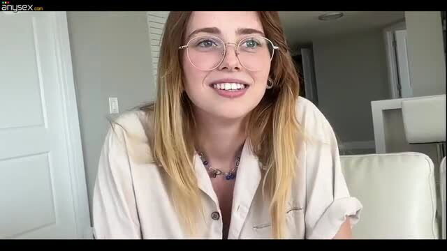 Renata Fox nerdy glasses blonde in white shirt smiling closeup