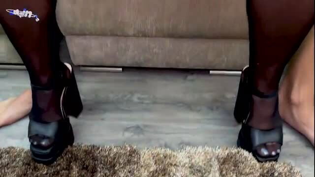 Kylie Ellis in black platform heels and sheer stockings, high angle foot view