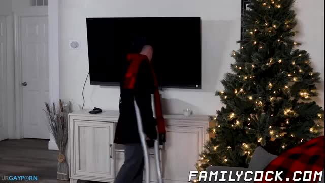 Hairy man with crutches in black robe receives Christmas cock from Alex Tikas
