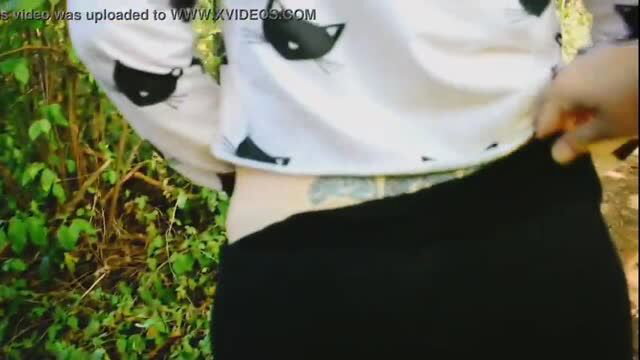 BBW exhibitionist shows belly tattoo in public park