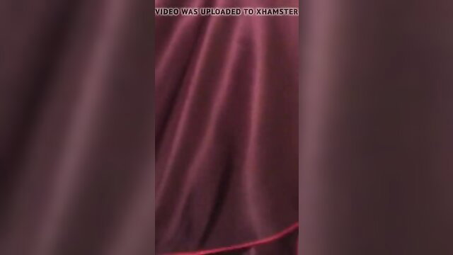 Malay tudung labuh woman in flowing purple hijab closeup