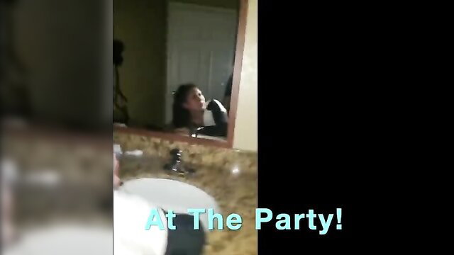 Asian amateur girl applying lipstick in mirror at the party
