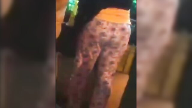 Indian woman in pink floral pajamas showing huge ass from behind