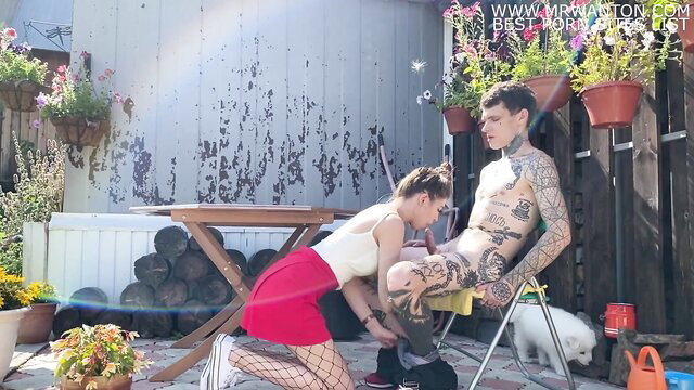 Vallery Ray in fishnets kneels sucking tattooed guy at cottage