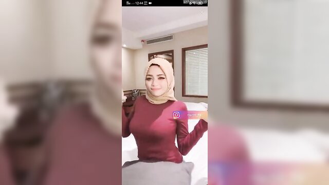Arini hijab in tight red top, seductive pose, always nude tease