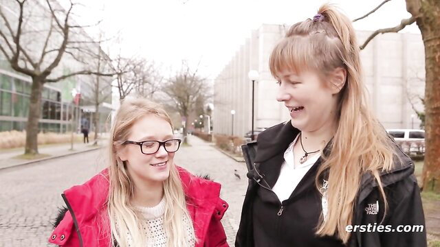Two blonde amateur teens smiling outdoors in coats, Ersties Bücherwürmer