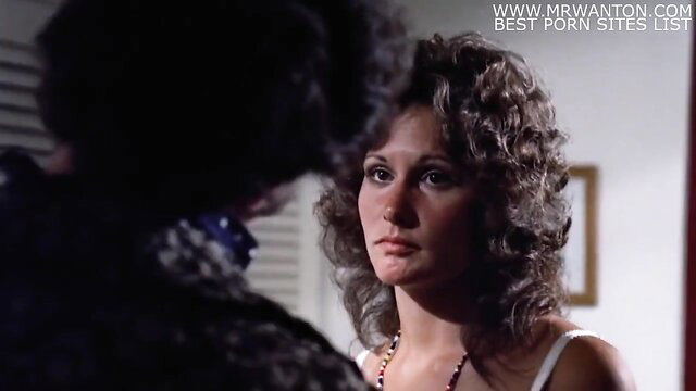 Gerard Damiano brunette with curly hair in tense closeup stare, 80s porn classic