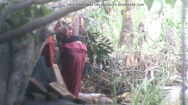 Indian Muslim teen in red saree outdoors, tight boob tease bath show
