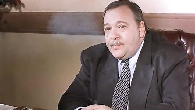 Vintage suited man with mustache smoking in Sin City porn scene