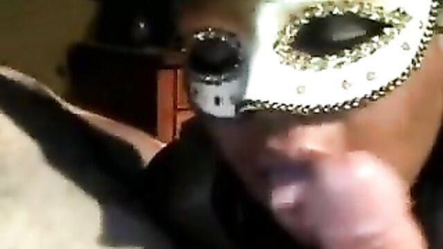 Hot brown carnival masked chick gives sloppy BJ closeup