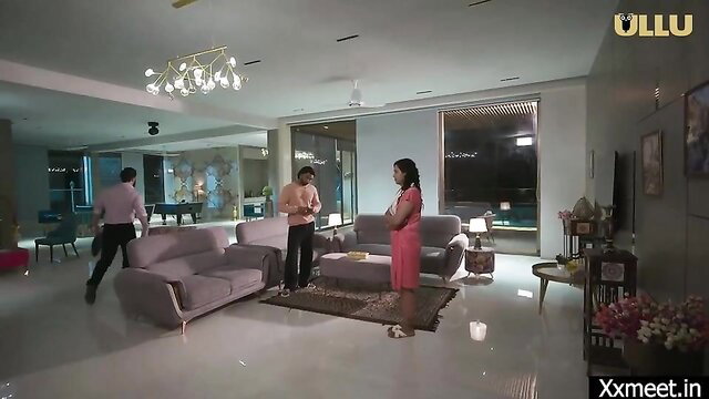 Indian MILF in red dress stands with man in living room XXX thumbnail