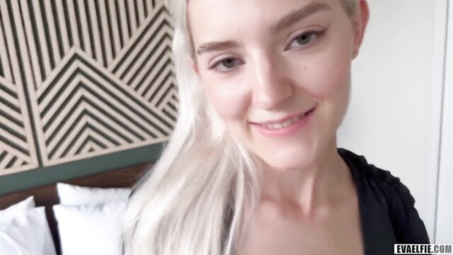 Eva Elfie smiles seductively in bed on first day in NY