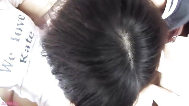 POV of Asian girl in 'We Love Kate' tee worshiping man's hair with bare feet