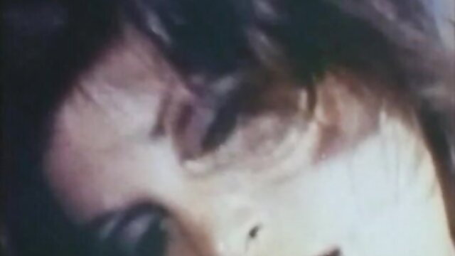Closeup of seductive woman's eye and lips in classic XXX video Hot Linda 2