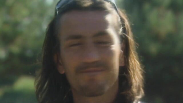 Nasty Lover squinting seductively outdoors, long hair, from Nasty Lovers