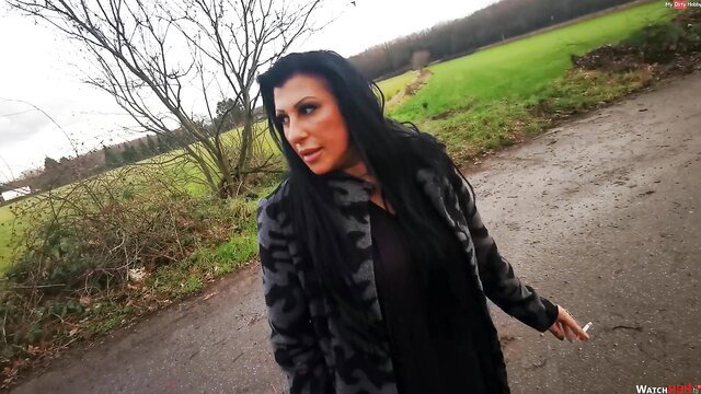 Lady Jamie smoking and dirty talk in fur coat outdoors, sexy brunette