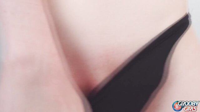 Autumn Rain Grooby Girls closeup teasing big tits in black thong