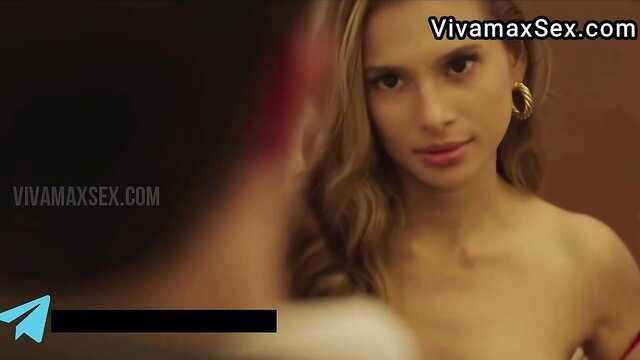 Blonde vixen in red dress with hoop earrings closeup from Secret Sessions 2024