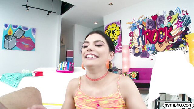 Sadie Blake smiling in orange halter top, Perved Family
