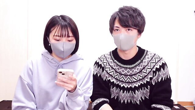 Masked Asian couple in hoodies, teasing slow sex vibes