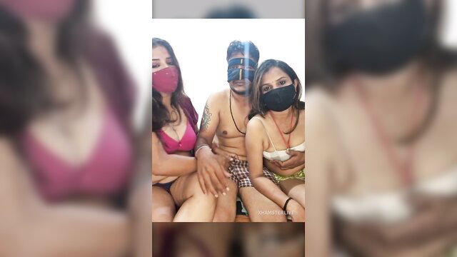 JoyanLove desi Indian threesome on Stripchat, masked man with two bikini babes