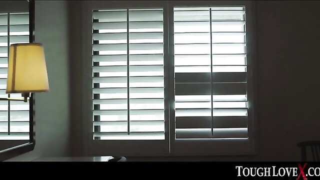 Nikole Nash in dimly lit room with blinds, ToughLoveX